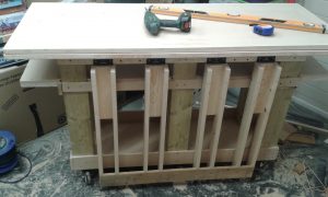 Small bench has a lift up flap which bolts to big bench so they become one. I had intended to fix table top extension to